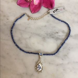 New 1928 Blue Necklace with bird pendant.
